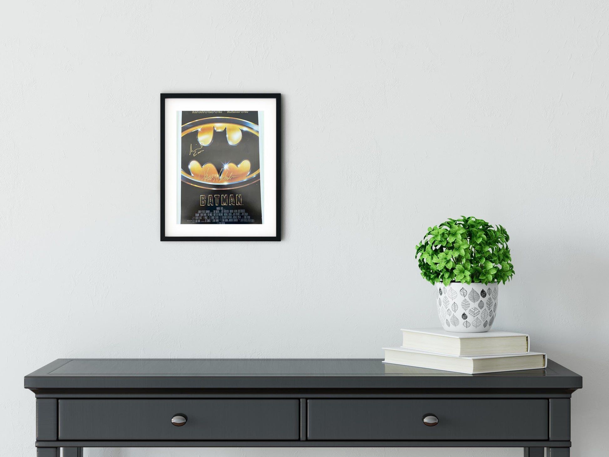 a black table with a potted plant on top of it