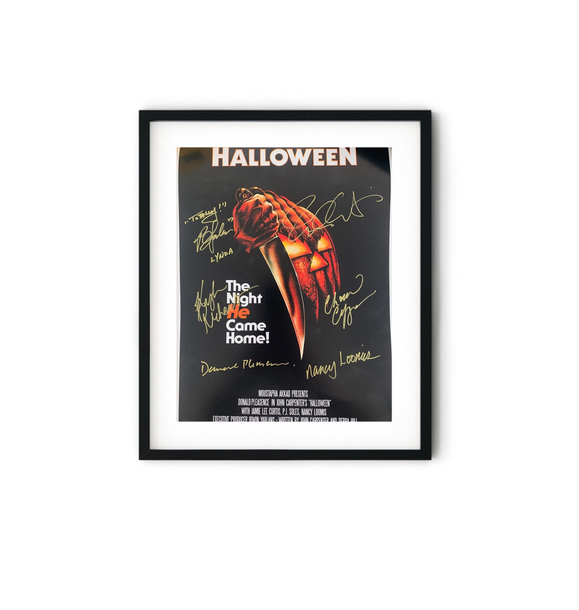 a framed halloween movie poster with autographs