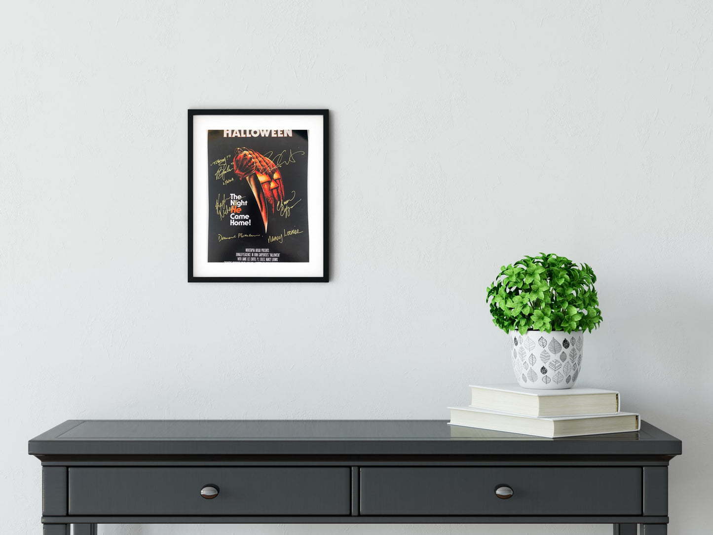 a black table with a potted plant on top of it