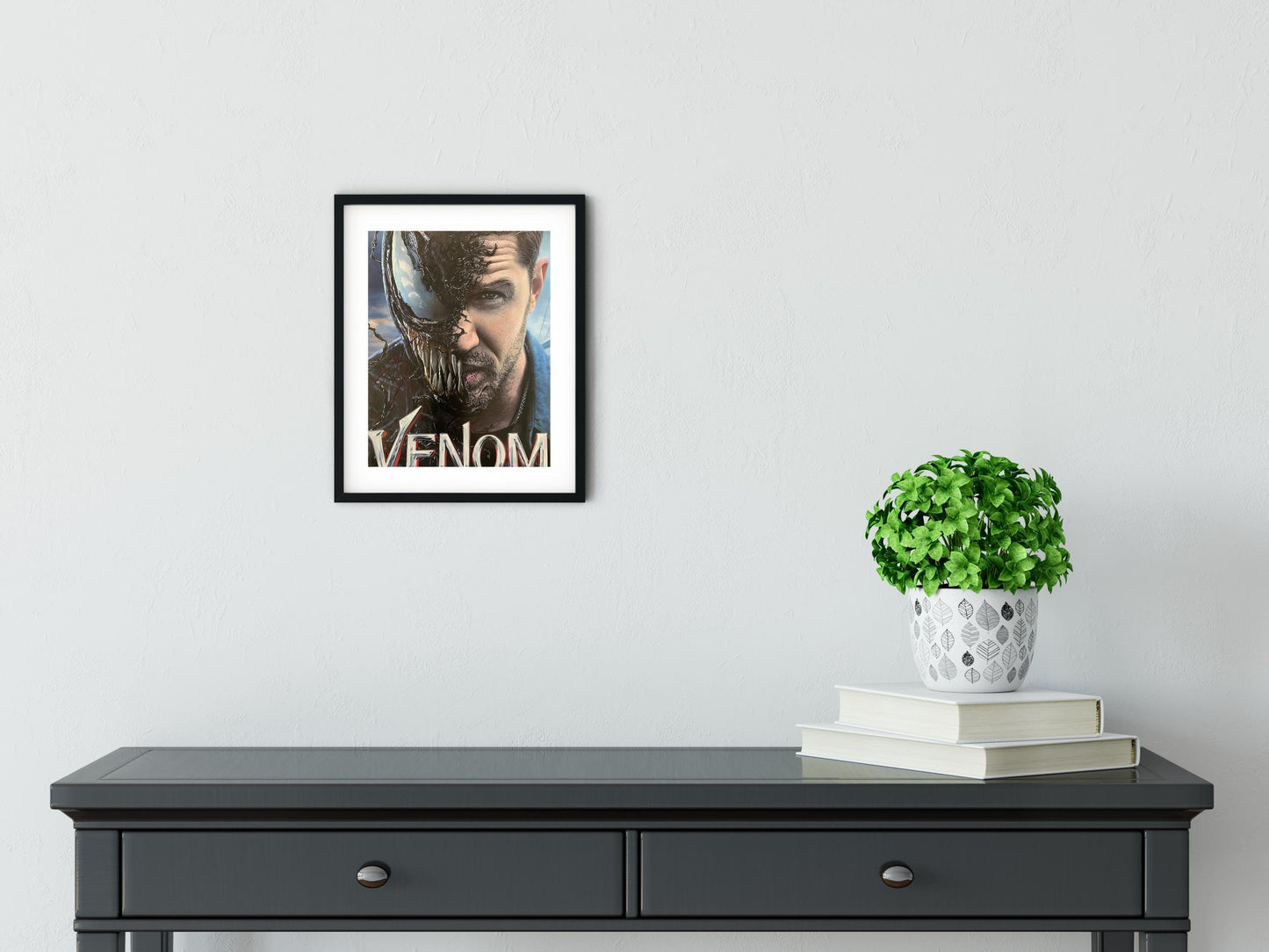 a black table with a potted plant on top of it