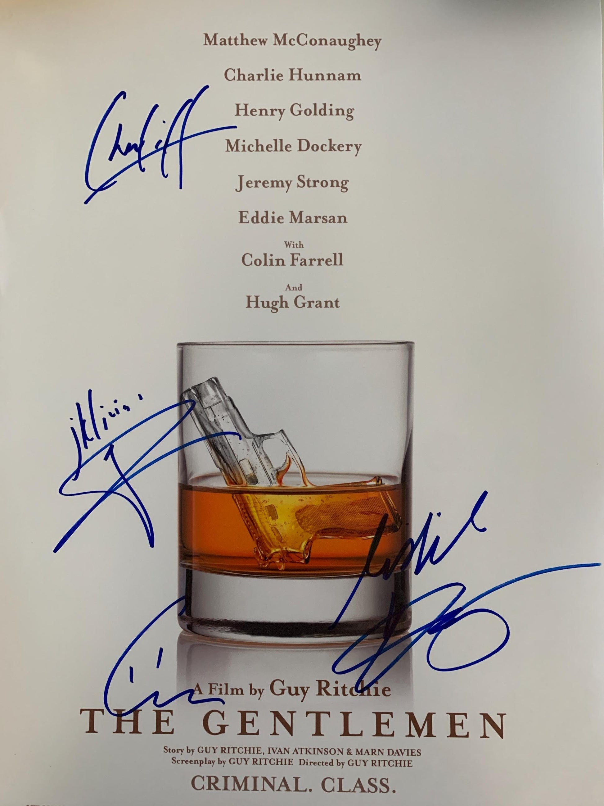 a bottle of whiskey with autographs on it