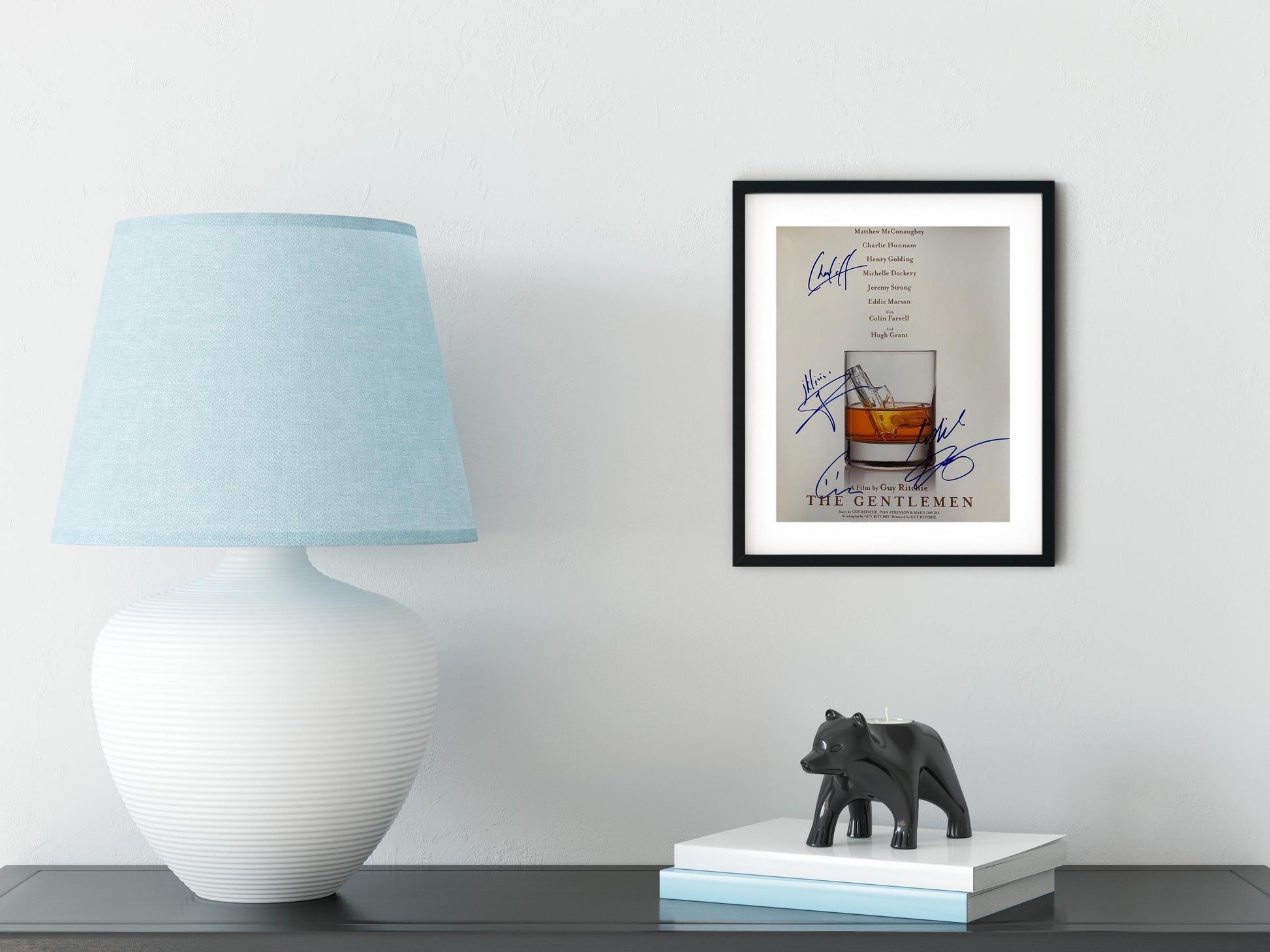 a picture of a glass of whiskey on a table next to a lamp